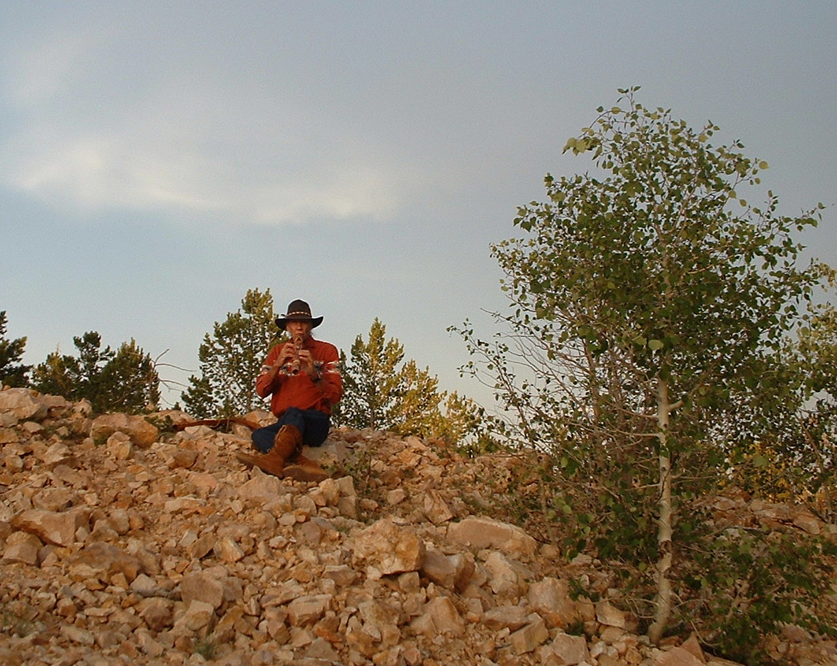 I am playing my flute on the summit of Navajo Mountain